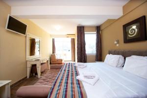 Postel nebo postele na pokoji v ubytování New Hotel Kuč By Marvel