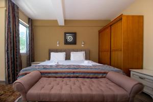 Postel nebo postele na pokoji v ubytování New Hotel Kuč By Marvel