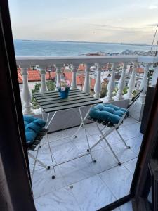 a view of a balcony with a table and chairs at Villa Nikoleta in Sveti Vlas