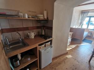 Kuchyňa alebo kuchynka v ubytovaní Apartmány U Koudelníka