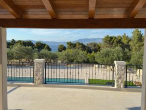 a balcony with a view of a fence at Villa Maginja in Sutivan
