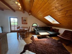 a living room with a couch and a table at Biohof Liebhart in Obing
