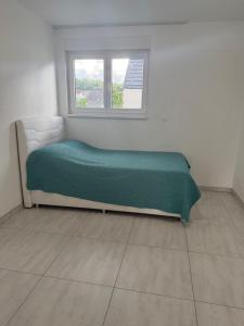 Postel nebo postele na pokoji v ubytování La maison du vignoble à BENNWIHR