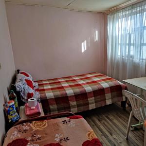 Postel nebo postele na pokoji v ubytování Conexión Urbana en el centro de Ambato