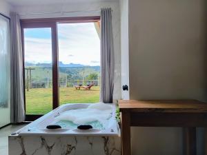 En eller flere senge i et værelse på CASA BELA VISTA -HIDRO - WIFI -PRÓXIMO RESTAURANTES e PIZZARIAS