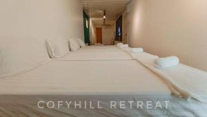 Postel nebo postele na pokoji v ubytování CofyHill Retreat