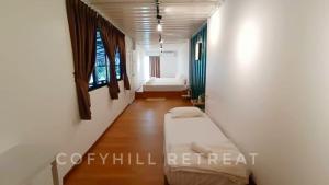 Postel nebo postele na pokoji v ubytování CofyHill Retreat