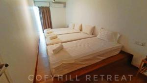 Postel nebo postele na pokoji v ubytování CofyHill Retreat