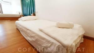 Postel nebo postele na pokoji v ubytování CofyHill Retreat