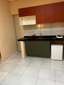 Køkken eller tekøkken på Flat Outono Aconchegante 2