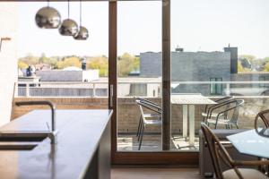 a view of a balcony with chairs and a table at Shangri-La 0202 G in Sint-Idesbald
