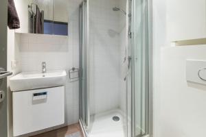 a bathroom with a shower and a sink at Shangri-La 0202 G in Sint-Idesbald +22 photos