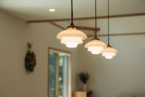 a group of lights hanging from a ceiling at New Villa Natural Q 城ケ崎海岸 伊豆高原 in Ito +67 photos