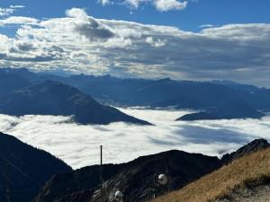 a view of the mountains with clouds in the sky at 1-bedroom holiday apartment in Oberstdorf