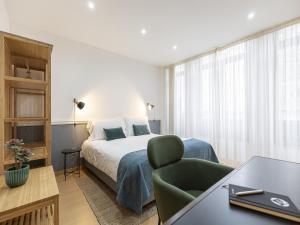 Ένα ή περισσότερα κρεβάτια σε δωμάτιο στο Feel Corporate Housing Marquês I