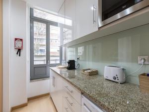Η κουζίνα ή μικρή κουζίνα στο Feel Corporate Housing Marquês I