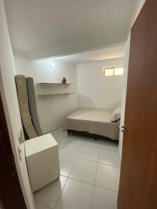 Ένα ή περισσότερα κρεβάτια σε δωμάτιο στο Apartamento a beira mar