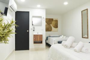 Postel nebo postele na pokoji v ubytování 33 HOTEL BOUTIQUE + 29 fotografií