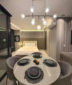 En eller flere senge i et værelse på Studio Boeing - Luxo e Conforto