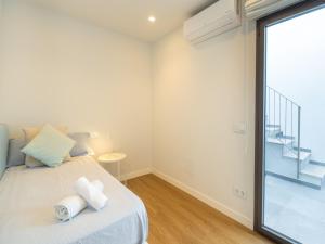 Postel nebo postele na pokoji v ubytování Stylish terraced house near the sea