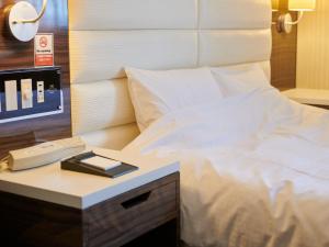 Postel nebo postele na pokoji v ubytování ORDA HOTEL