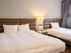 Postel nebo postele na pokoji v ubytování ORDA HOTEL