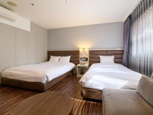 Postel nebo postele na pokoji v ubytování ORDA HOTEL