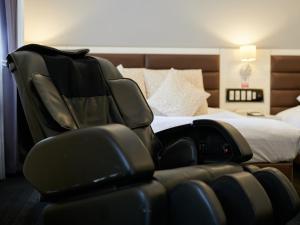 Postel nebo postele na pokoji v ubytování ORDA HOTEL