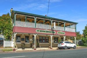 a building with a car parked in front of it at The Royal Hotel Morpeth in Morpeth