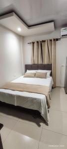 Postel nebo postele na pokoji v ubytování Hospedaje Bustamante 3155