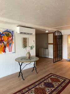 a room with a table and a painting on the wall at SeaView Havterassen in Blankaholm +27 photos