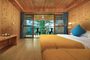 Postel nebo postele na pokoji v ubytování Longji Aplo Leisure B&B