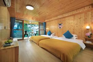 Postel nebo postele na pokoji v ubytování Longji Aplo Leisure B&B