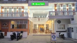 a building with motorcycles parked in front of it at Ola De Baler in Baler