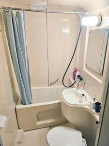 Koupelna v ubytování Guest House Vingt-Neuf 美好境界湯澤館 + 17 fotografií