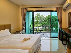 เตียงในห้องที่ Top Place Pakchong +50 ภาพ