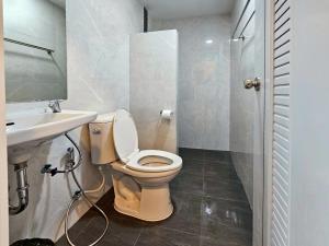 a bathroom with a toilet and a sink at Top Place in Ban Pang Kae +44 photos