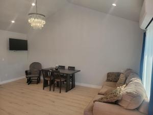 a living room with a couch and a table at Casa One in Winnetka