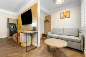 a living room with a couch and a table at Star Motel in San Francisco
