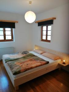 Posteľ alebo postele v izbe v ubytovaní Blockhaus Familie Raidl