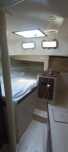 a small room with a bed on a boat at Sv Lukas in Bocas del Toro
