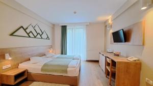 TV a/nebo společenská místnost v ubytování Hotel Kolping