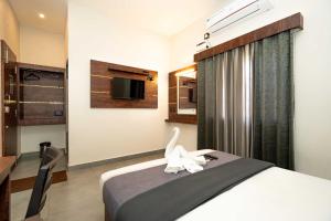 Postel nebo postele na pokoji v ubytování HOTEL ELITE