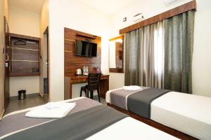 Postel nebo postele na pokoji v ubytování HOTEL ELITE