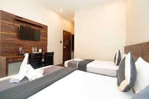 Postel nebo postele na pokoji v ubytování HOTEL ELITE