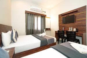 Postel nebo postele na pokoji v ubytování HOTEL ELITE