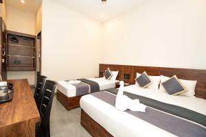 Postel nebo postele na pokoji v ubytování HOTEL ELITE