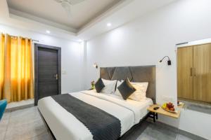 Postel nebo postele na pokoji v ubytování Hotel Admire Inn Sector 104