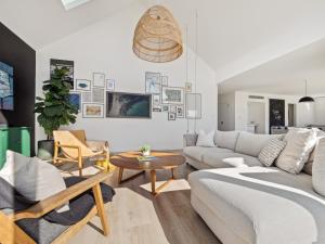 a living room with a couch and a table at Space+Light lounge by pool walk to town beach in Dunsborough