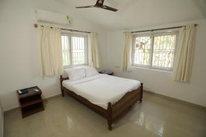 Ένα ή περισσότερα κρεβάτια σε δωμάτιο στο Meadows - 4BHK Private pool Villa, Bangalore +53 φωτογραφίες